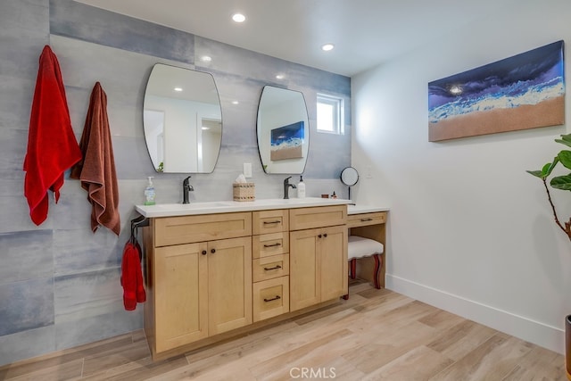9171 Heatherton Cir, Huntington Beach, CA 92646 - bathroom featuring wood finished floors, double vanity, baseboards, and recessed lighting