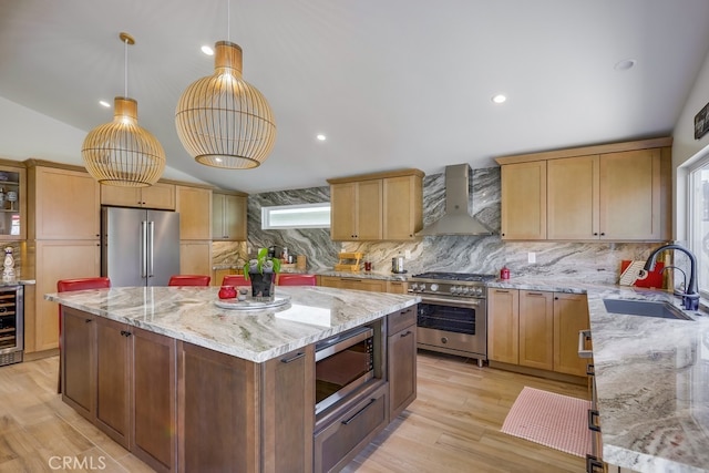 9171 Heatherton Cir, Huntington Beach, CA 92646 - kitchen featuring high quality appliances, a sink, wall chimney exhaust hood, decorative backsplash, and vaulted ceiling
