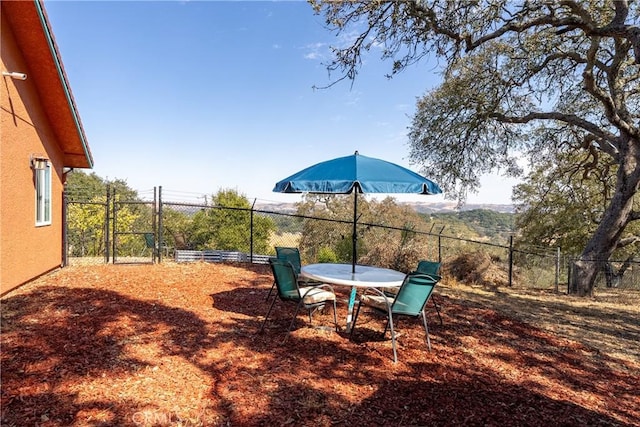 10755 Santa Ana Rd, Atascadero, CA 93422 - fenced backyard featuring outdoor dining space and a gate