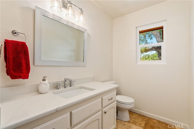 10755 Santa Ana Rd, Atascadero, CA 93422 - bathroom featuring vanity, toilet, and baseboards