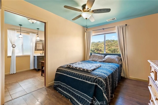 10755 Santa Ana Rd, Atascadero, CA 93422 - bedroom with hardwood / wood-style floors, baseboards, a ceiling fan, and a sink
