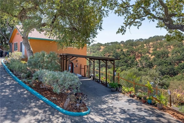 10755 Santa Ana Rd, Atascadero, CA 93422 - view of community featuring driveway, a forest view, and a carport