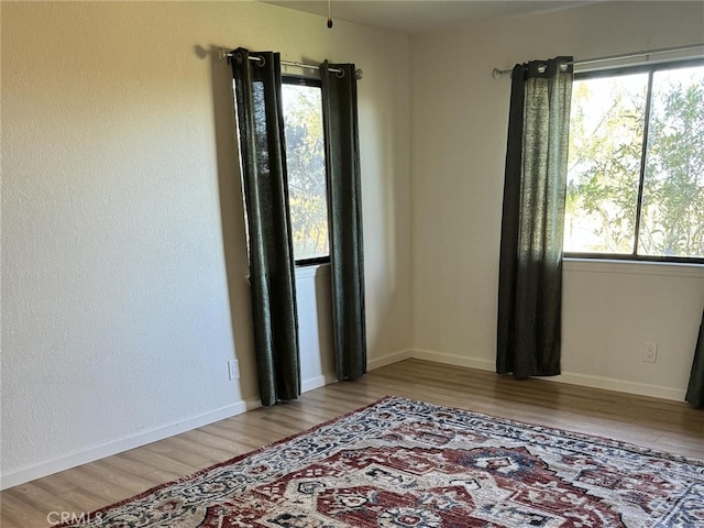 10755 Santa Ana Rd, Atascadero, CA 93422 - empty room with wood finished floors and baseboards