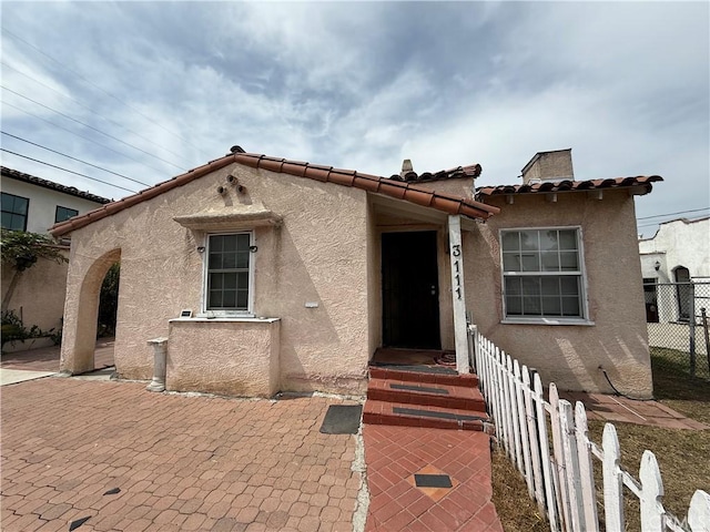 3111 W 57th St, Los Angeles, CA 90043 - mediterranean / spanish-style house with stucco siding and a tiled roof