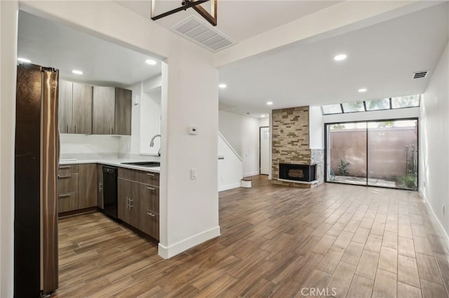 25761 Le Parc Unit 89, Lake Forest, CA 92630 - kitchen featuring freestanding refrigerator, dishwasher, dark wood-type flooring, light countertops, and recessed lighting