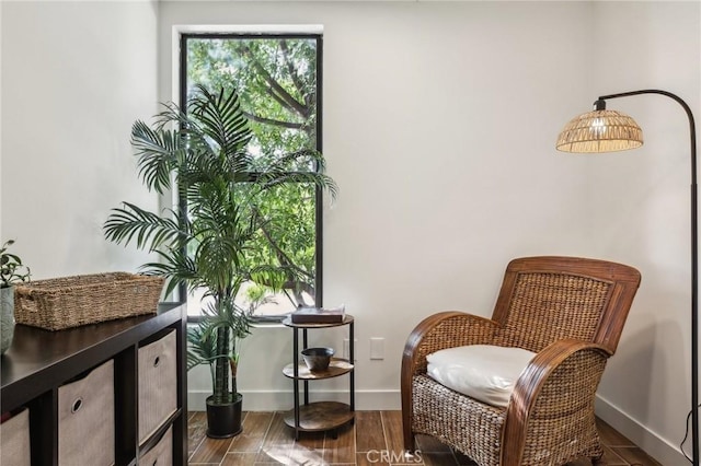 25761 Le Parc Unit 89, Lake Forest, CA 92630 - sitting room featuring baseboards and wood finished floors