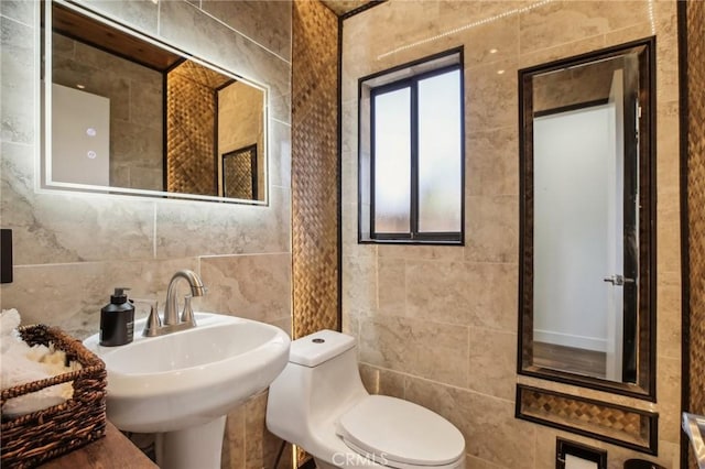 25761 Le Parc Unit 89, Lake Forest, CA 92630 - bathroom with tile walls, toilet, and a sink