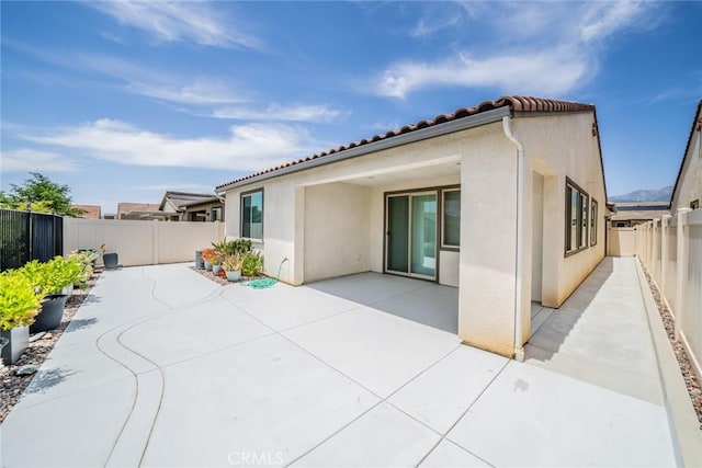 1521 Summerfield Way, Beaumont, CA 92223 - rear view of property featuring a patio area, a fenced backyard, and stucco siding