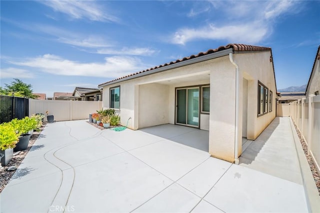 1521 Summerfield Way, Beaumont, CA 92223 - back of house with a patio, a fenced backyard, and stucco siding
