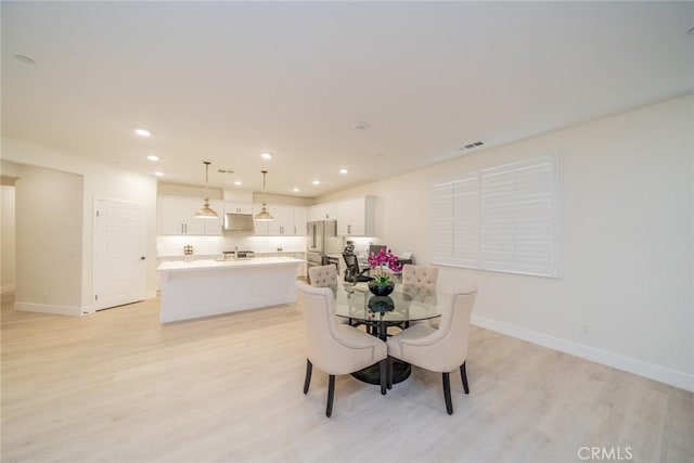 1521 Summerfield Way, Beaumont, CA 92223 - dining room featuring light wood-style floors, baseboards, and recessed lighting