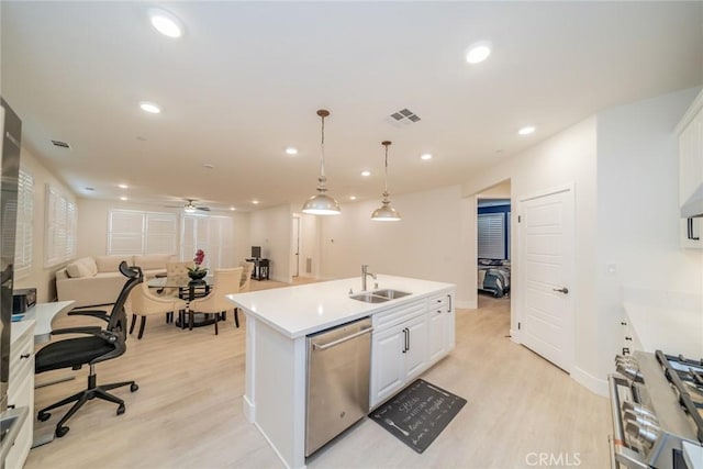 1521 Summerfield Way, Beaumont, CA 92223 - kitchen with dishwasher, range, light wood-style flooring, open floor plan, and white cabinetry