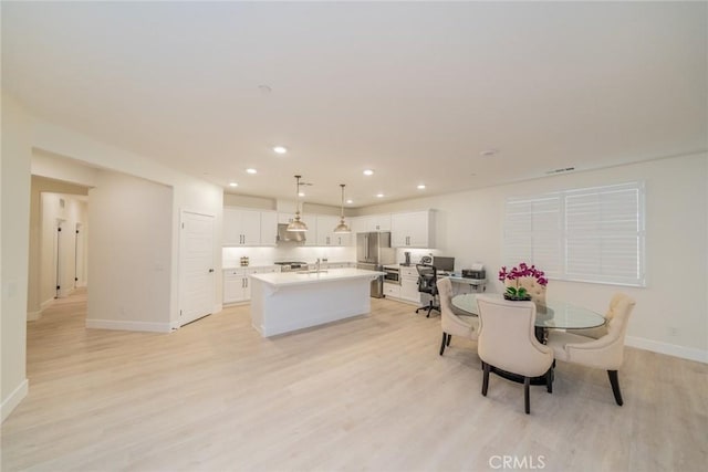 1521 Summerfield Way, Beaumont, CA 92223 - dining area featuring light wood-style floors, baseboards, and recessed lighting