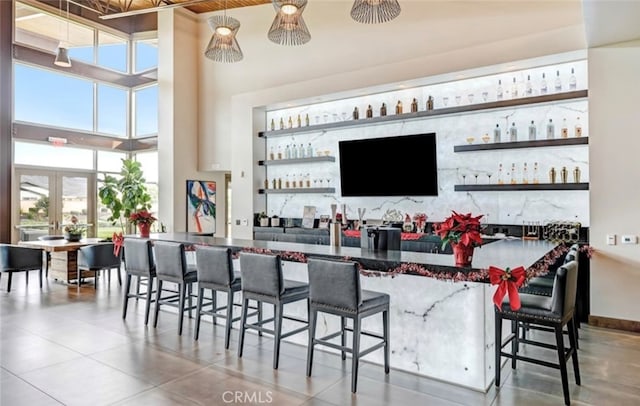 1521 Summerfield Way, Beaumont, CA 92223 - indoor dry bar featuring a towering ceiling and tile patterned flooring