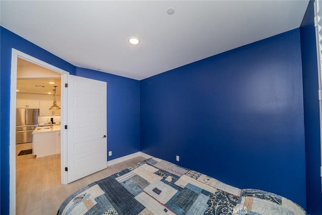 1521 Summerfield Way, Beaumont, CA 92223 - unfurnished bedroom with stainless steel refrigerator, light wood finished floors, baseboards, and recessed lighting
