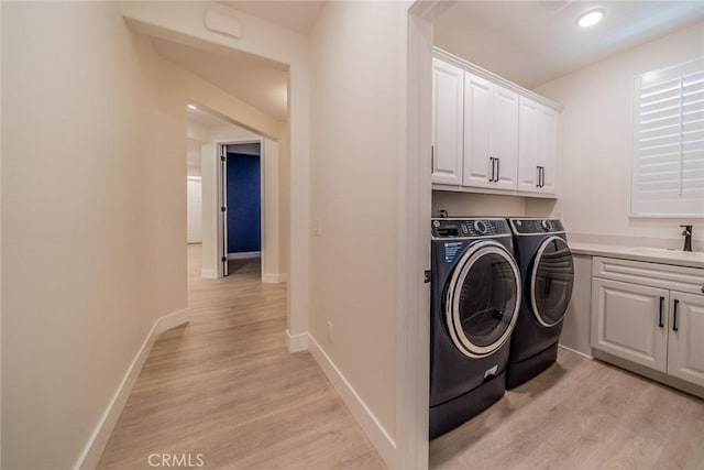 1521 Summerfield Way, Beaumont, CA 92223 - laundry room with independent washer and dryer, cabinet space, light wood-style floors, and baseboards