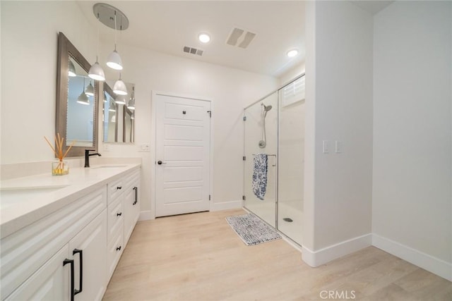 1521 Summerfield Way, Beaumont, CA 92223 - full bath with a shower stall, double vanity, and wood finished floors