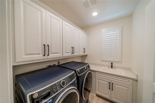 1521 Summerfield Way, Beaumont, CA 92223 - laundry area featuring washing machine and dryer and cabinet space