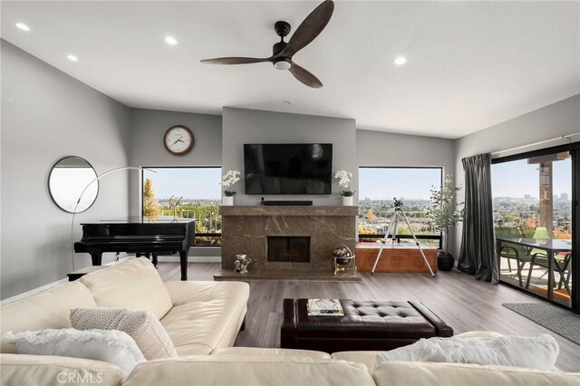 1995 Molino Ave Unit 301, Signal Hill, CA 90755 - living area featuring a ceiling fan, recessed lighting, wood finished floors, a premium fireplace, and vaulted ceiling