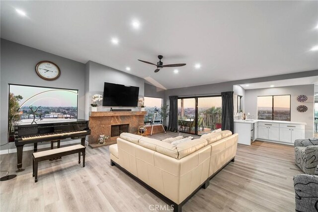 1995 Molino Ave Unit 301, Signal Hill, CA 90755 - living room with a ceiling fan, vaulted ceiling, light wood-style flooring, a premium fireplace, and recessed lighting