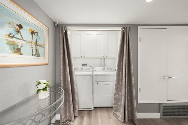 1995 Molino Ave Unit 301, Signal Hill, CA 90755 - washroom with cabinet space, independent washer and dryer, and light wood-style floors