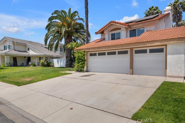 575 Nicole Dr, Newbury Park, CA 91320 - view of front of house featuring concrete driveway, solar panels, stucco siding, an attached garage, and a tile roof