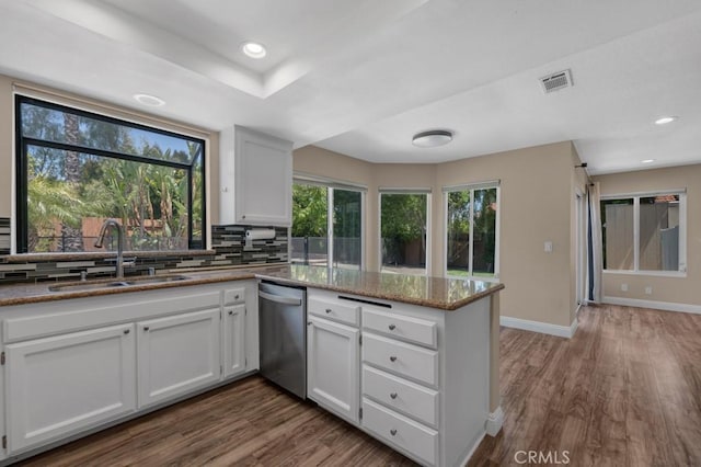 575 Nicole Dr, Newbury Park, CA 91320 - kitchen featuring dishwasher, a sink, a peninsula, dark wood-style floors, and white cabinets