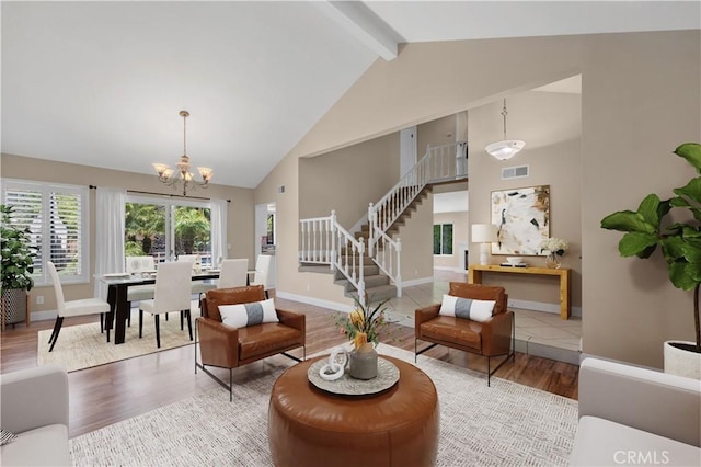 575 Nicole Dr, Newbury Park, CA 91320 - living area featuring stairway, high vaulted ceiling, a chandelier, beam ceiling, and wood finished floors