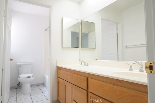 14678 Tupper St, Panorama City, CA 91402 - full bath with double vanity, toilet, tile patterned flooring,  shower combination, and baseboards