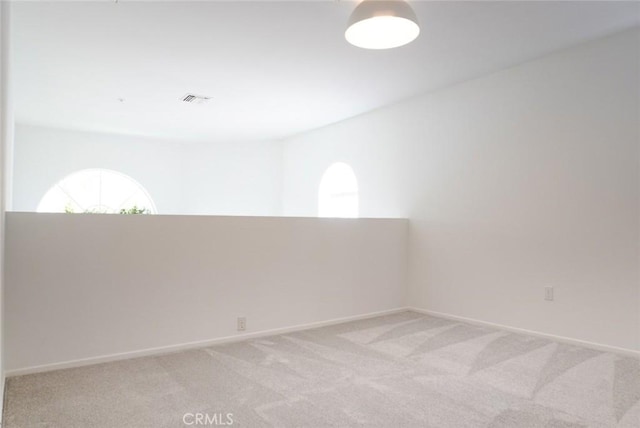 14678 Tupper St, Panorama City, CA 91402 - empty room with plenty of natural light, light colored carpet, and baseboards