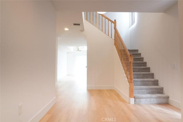 14678 Tupper St, Panorama City, CA 91402 - stairway featuring baseboards, wood finished floors, and recessed lighting