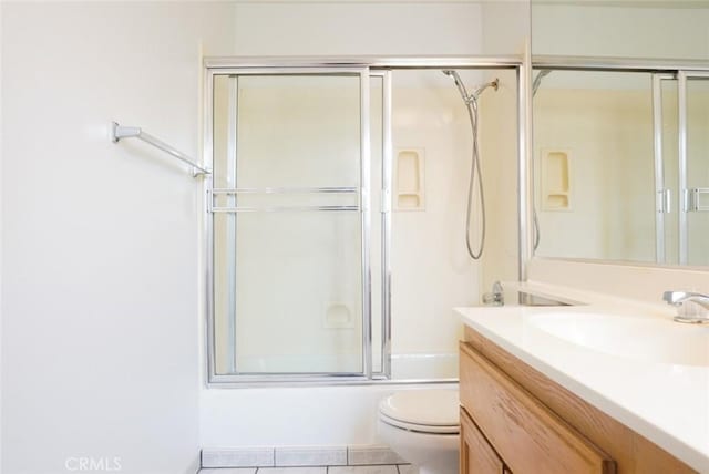 14678 Tupper St, Panorama City, CA 91402 - bathroom featuring vanity, toilet, combined bath / shower with glass door, and tile patterned flooring