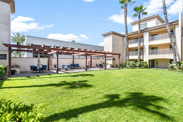 17230 Newhope St Unit 309, Fountain Valley, CA 92708 - view of green lawn with a pergola and a patio area