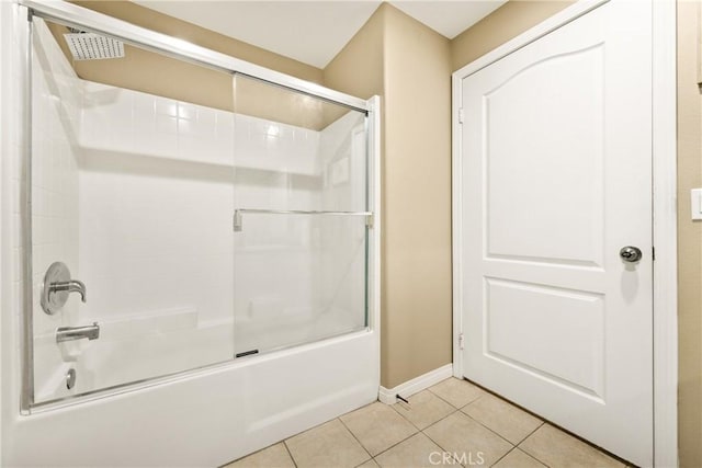 17230 Newhope St Unit 309, Fountain Valley, CA 92708 - bathroom featuring tile patterned floors, combined bath / shower with glass door, and baseboards