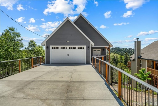 851 Madera Ln, Lake Arrowhead, CA 92352 - view of front facade featuring an attached garage and concrete driveway