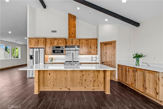 851 Madera Ln, Lake Arrowhead, CA 92352 - kitchen with stainless steel fridge with ice dispenser, beam ceiling, light countertops, dark wood-style floors, and a center island with sink