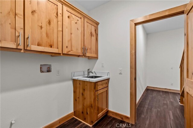851 Madera Ln, Lake Arrowhead, CA 92352 - laundry area with cabinet space, hookup for a washing machine, dark wood-type flooring, and baseboards