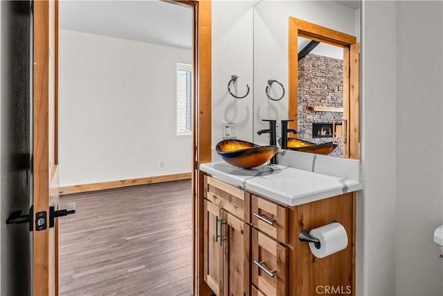 851 Madera Ln, Lake Arrowhead, CA 92352 - bathroom featuring wood finished floors, toilet, baseboards, and vanity