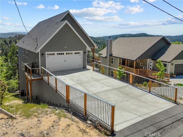 851 Madera Ln, Lake Arrowhead, CA 92352 - view of front facade with concrete driveway and a garage