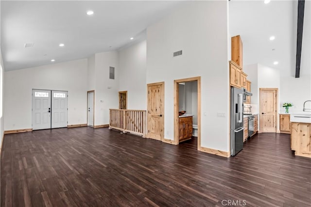 851 Madera Ln, Lake Arrowhead, CA 92352 - unfurnished living room with high vaulted ceiling, dark wood-style flooring, baseboards, recessed lighting, and a sink