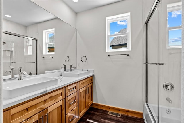 851 Madera Ln, Lake Arrowhead, CA 92352 - full bathroom with wood finished floors, double vanity, baseboards, and combined bath / shower with glass door