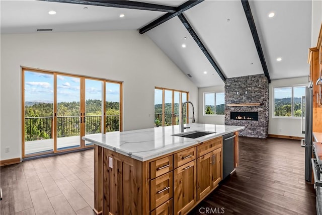 851 Madera Ln, Lake Arrowhead, CA 92352 - kitchen featuring a sink, a fireplace, stainless steel dishwasher, beam ceiling, and open floor plan