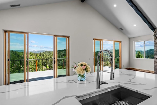 851 Madera Ln, Lake Arrowhead, CA 92352 - kitchen featuring a sink, high vaulted ceiling, recessed lighting, light stone counters, and beamed ceiling