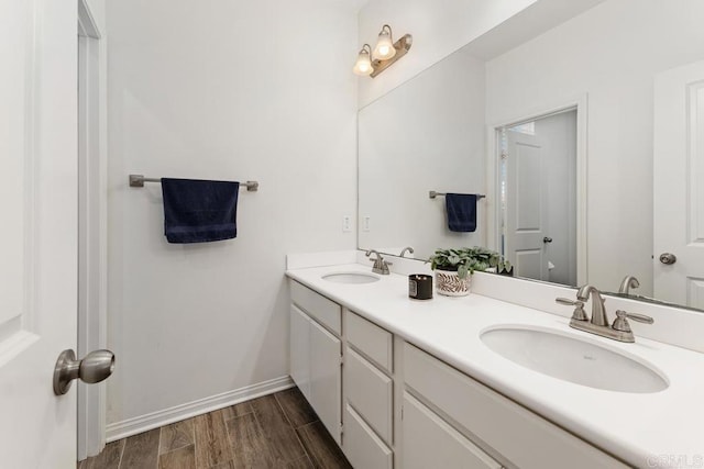 1710 Moon Orchid Ave, Chula Vista, CA 91913 - full bathroom featuring double vanity, wood finished floors, and baseboards