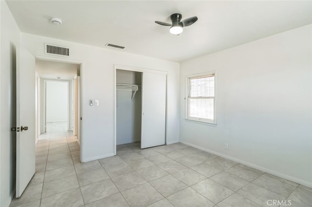 34540 Western Dr, Barstow, CA 92311 - unfurnished bedroom with a closet, light tile patterned floors, and baseboards