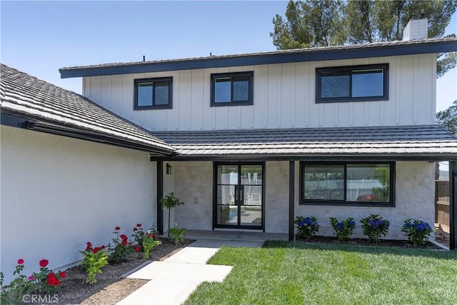 26050 Farmfield Rd, Calabasas, CA 91302 - view of front of property with a front yard, stone siding, and a chimney