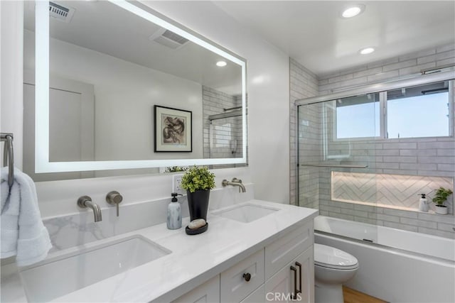 26050 Farmfield Rd, Calabasas, CA 91302 - full bath featuring toilet, double vanity, bath / shower combo with glass door, and recessed lighting
