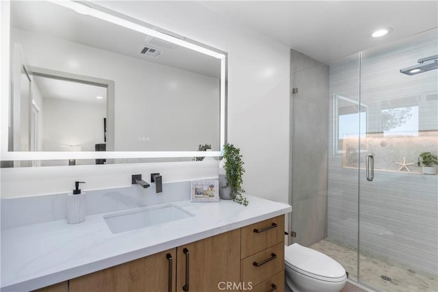 26050 Farmfield Rd, Calabasas, CA 91302 - bathroom featuring vanity, toilet, a stall shower, and recessed lighting
