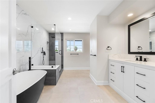 18311 Chase St, Northridge, CA 91325 - full bath with a soaking tub, vanity, a marble finish shower, baseboards, and recessed lighting