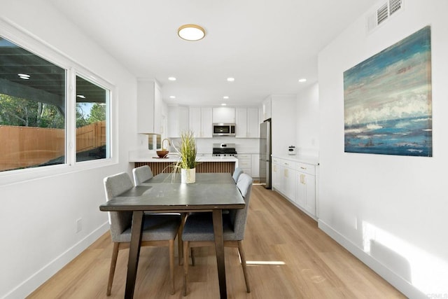 2858 Lehigh Ct, Oceanside, CA 92056 - dining space with light wood-style floors, baseboards, and recessed lighting