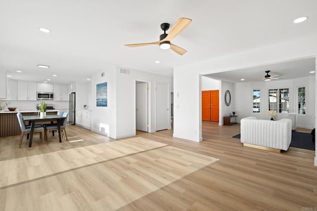 2858 Lehigh Ct, Oceanside, CA 92056 - living area with ceiling fan, recessed lighting, light wood-style floors, and baseboards